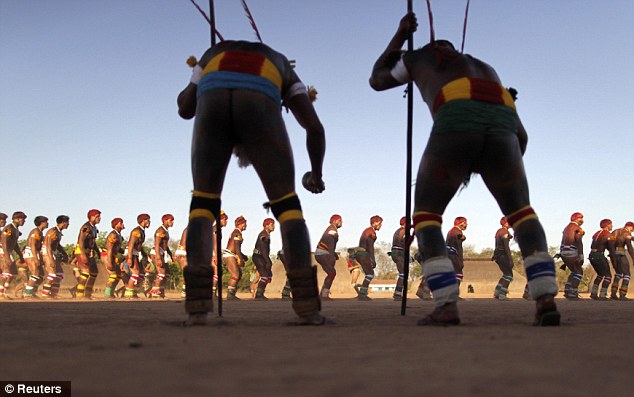 Organised: Yawalapiti men, some bearing sticks, dance in formation during this year's quarup