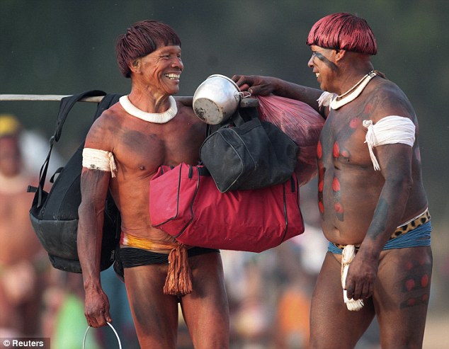 Welcome: A Yawalapiti man (right) greets a man from another tribe who arrived to attend this year's quarup